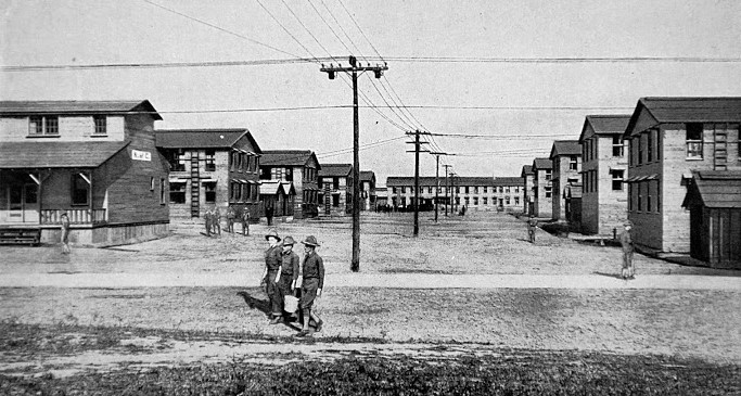 SOLDIERS WALKING barracks in background 1